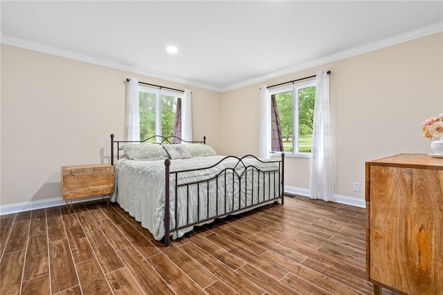 601 Overlook Dr, Opelika, AL 36801 - bedroom with crown molding, multiple windows, baseboards, and dark wood finished floors