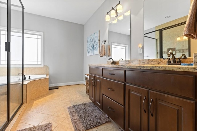 bathroom with shower with separate bathtub, vanity, and tile patterned floors