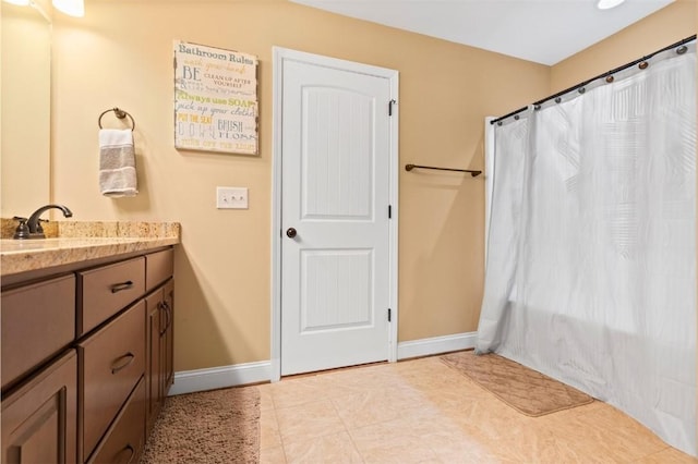 bathroom with tile patterned floors, vanity, and shower / bath combo