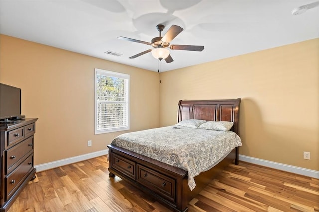 bedroom with ceiling fan and light wood-type flooring