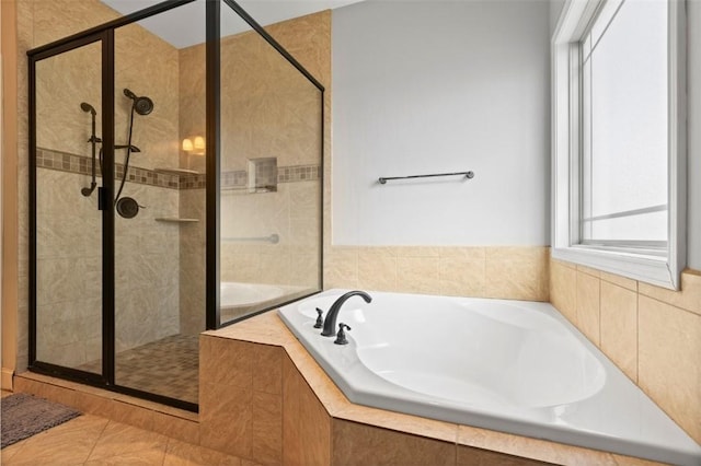 bathroom with shower with separate bathtub