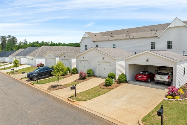 multi unit property featuring a residential view, concrete driveway, roof with shingles, and an attached garage