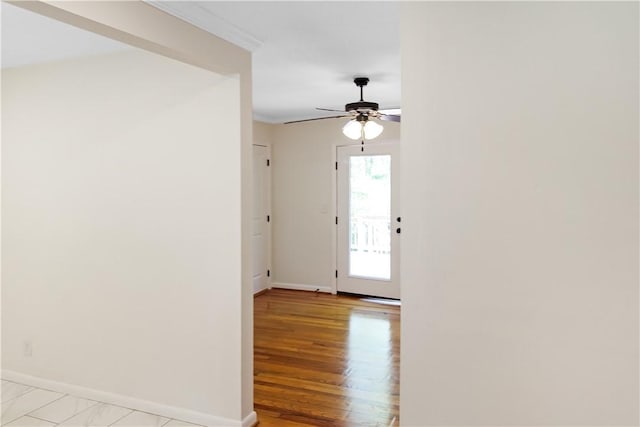 empty room with baseboards and ceiling fan