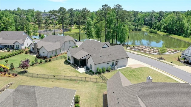 birds eye view of property featuring a water view