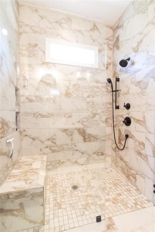 bathroom featuring a tile shower