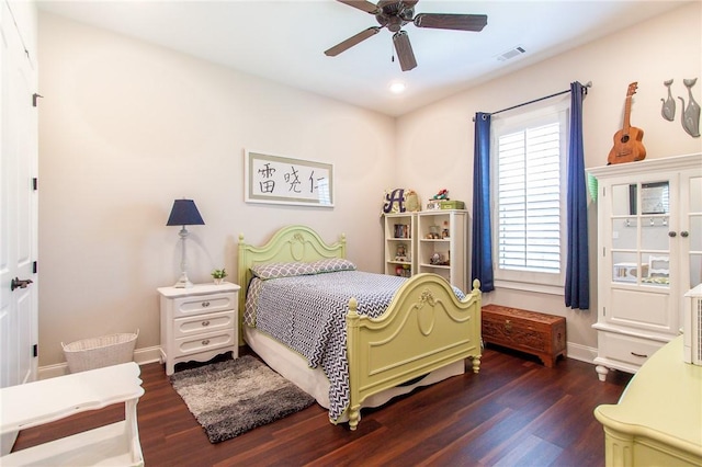 bedroom with ceiling fan and dark wood-type flooring