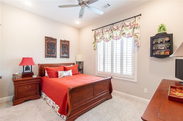 bedroom with ceiling fan and light carpet