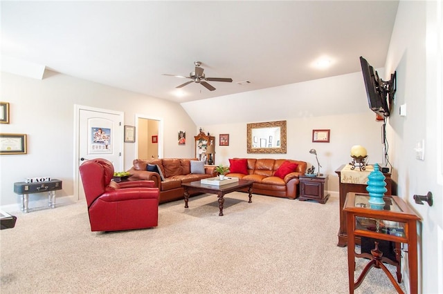 living room with ceiling fan, light colored carpet, and vaulted ceiling