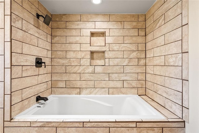full bath featuring recessed lighting and tiled shower / bath combo