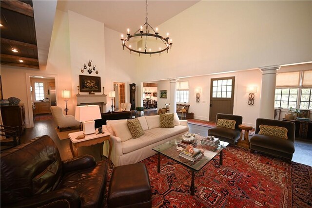 1707 Candler Way, Auburn, AL 36830 - living area featuring decorative columns, a chandelier, wood finished floors, high vaulted ceiling, and recessed lighting