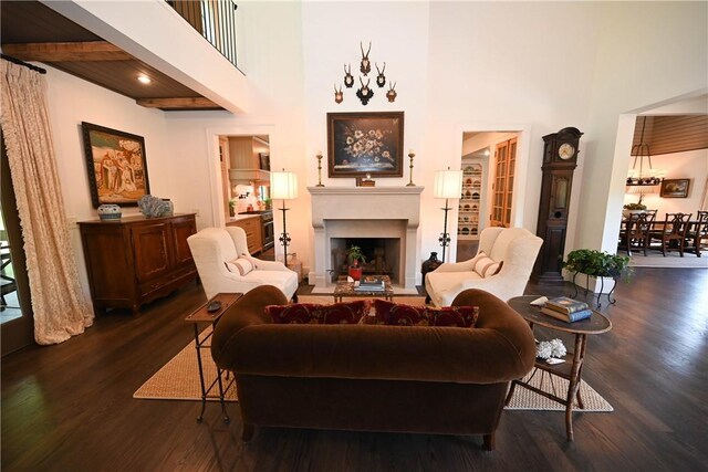 1707 Candler Way, Auburn, AL 36830 - living room with a towering ceiling, ornate columns, wood finished floors, a chandelier, and stairway