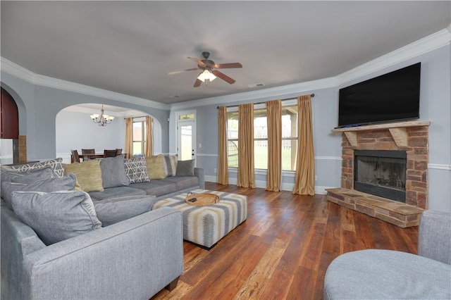 151 Landing Way, Smiths Station, AL 36877 - living area with arched walkways, wood finished floors, crown molding, a chandelier, and a ceiling fan