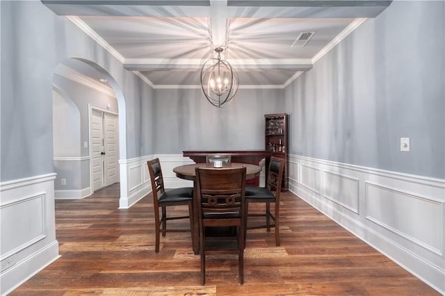 151 Landing Way, Smiths Station, AL 36877 - dining room with ornamental molding, a chandelier, arched walkways, wood finished floors, and a wainscoted wall