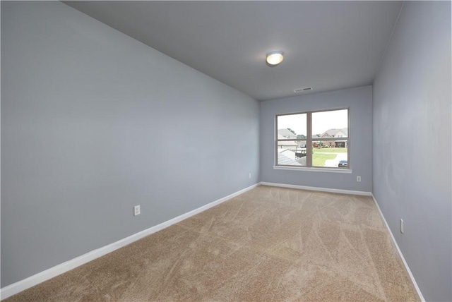 151 Landing Way, Smiths Station, AL 36877 - spare room featuring light colored carpet and baseboards