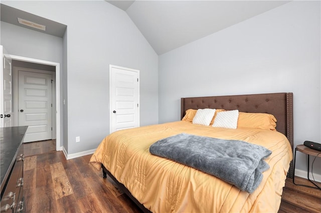 151 Landing Way, Smiths Station, AL 36877 - bedroom with vaulted ceiling and dark wood-type flooring