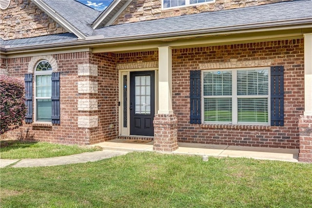 151 Landing Way, Smiths Station, AL 36877 - entrance to property featuring brick siding, a yard, and roof with shingles