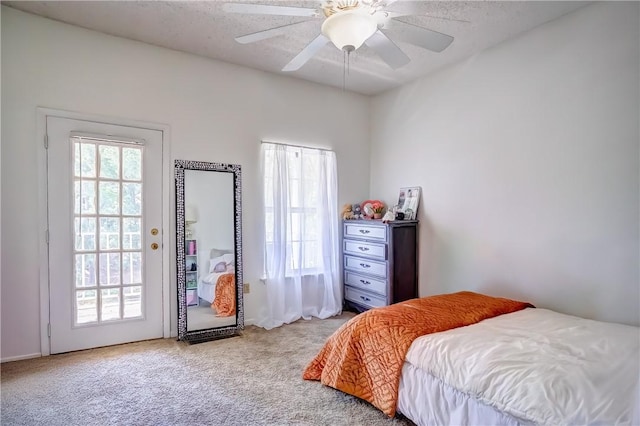 162 E University Dr Unit I201, Auburn, AL 36832 - bedroom with carpet flooring, ceiling fan, access to outside, and a textured ceiling