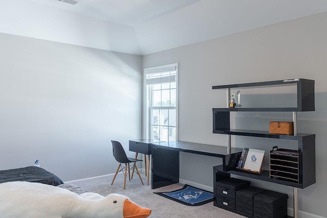 office space featuring vaulted ceiling and carpet floors