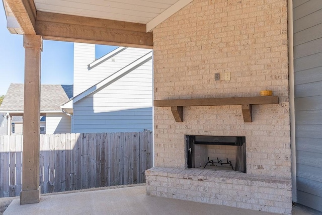 exterior space featuring an outdoor brick fireplace