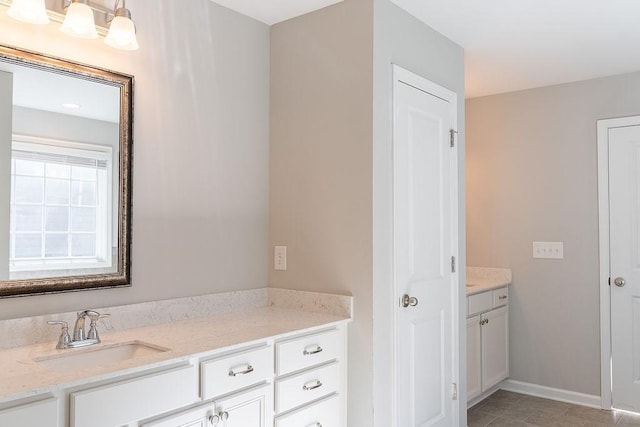 bathroom with vanity and tile patterned floors