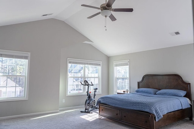 carpeted bedroom with vaulted ceiling and ceiling fan