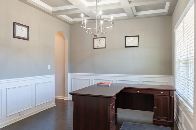 unfurnished office featuring plenty of natural light, coffered ceiling, and dark hardwood / wood-style flooring