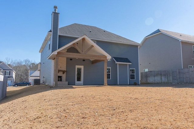 back of property featuring central AC unit