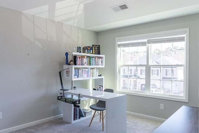 office area featuring light carpet