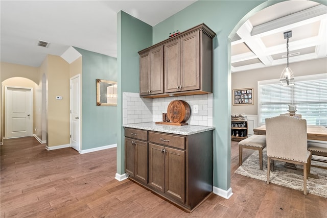 2655 Anderson Ct, Auburn, AL 36832 - bar with arched walkways, backsplash, light wood-style flooring, coffered ceiling, and beam ceiling