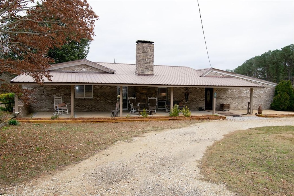 rear view of house with a porch