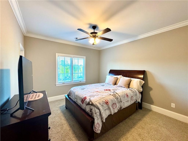 bedroom featuring ornamental molding, baseboards, and carpet floors