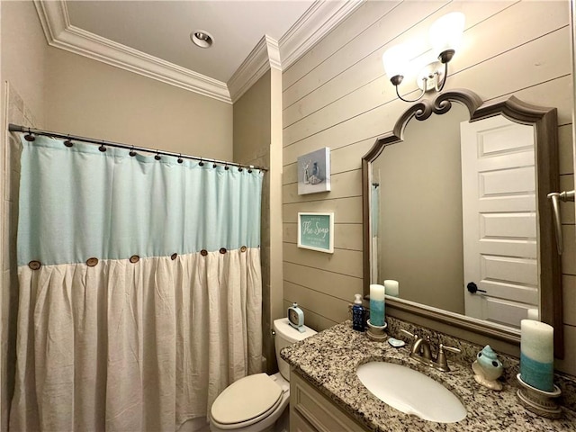 bathroom featuring toilet, crown molding, wood walls, and vanity
