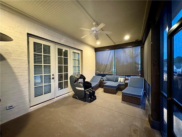 view of patio / terrace with an outdoor living space, french doors, and a ceiling fan