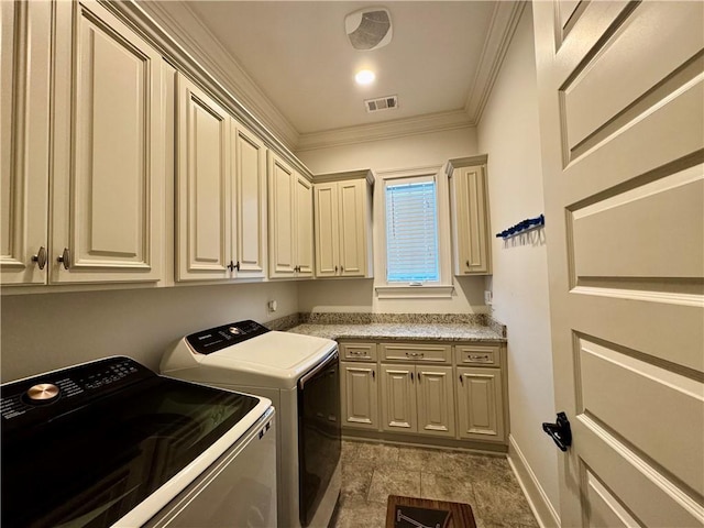 laundry room featuring visible vents, baseboards, crown molding, independent washer and dryer, and cabinet space