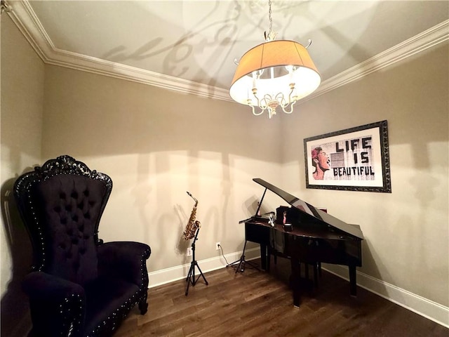 sitting room with wood finished floors, an inviting chandelier, baseboards, and ornamental molding