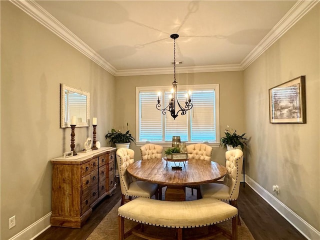 dining space featuring crown molding, an inviting chandelier, baseboards, and dark wood finished floors