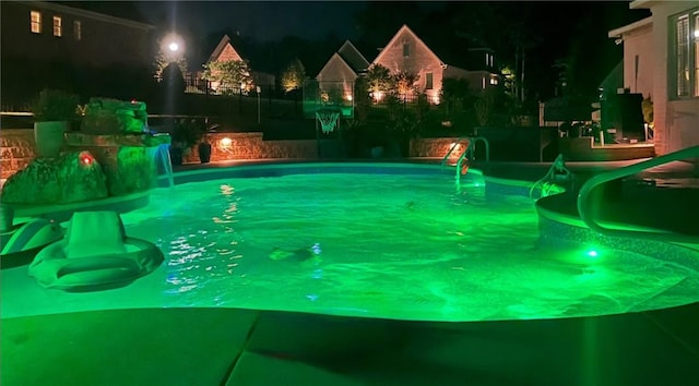 pool at twilight with an outdoor pool