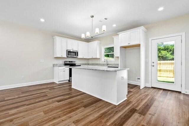 3260 Academy Dr Unit 408, Opelika, AL 36801 - kitchen featuring appliances with stainless steel finishes, white cabinets, wood finished floors, and recessed lighting