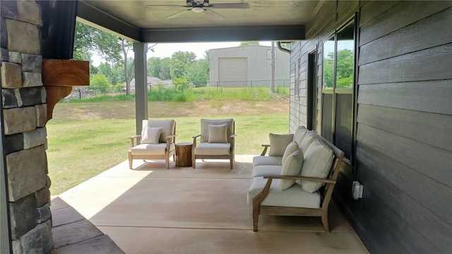 view of patio with a ceiling fan and fence
