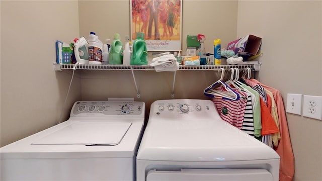 clothes washing area featuring washing machine and clothes dryer