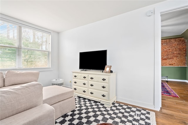 living room with wood finished floors and baseboards