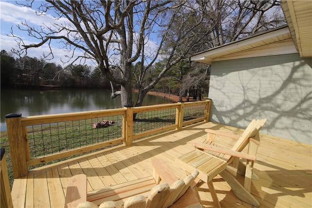 wooden terrace featuring a water view