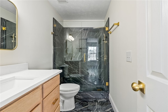 full bath with toilet, marble finish floor, a marble finish shower, and a textured ceiling