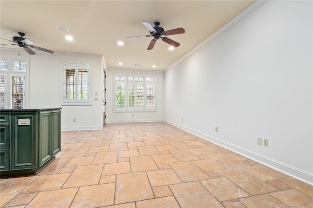 spare room with crown molding, recessed lighting, baseboards, and ceiling fan