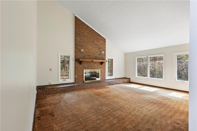 unfurnished living room with high vaulted ceiling, a brick fireplace, and carpet flooring