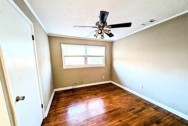 spare room with ceiling fan, ornamental molding, dark hardwood / wood-style floors, and a textured ceiling