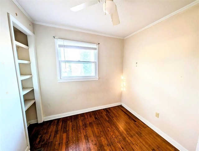 unfurnished room featuring crown molding, dark hardwood / wood-style floors, and ceiling fan