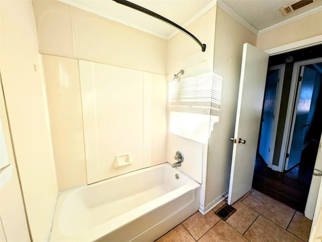 bathroom with shower / bathing tub combination, crown molding, tile patterned floors, and a textured ceiling