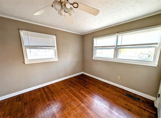 spare room featuring crown molding, ceiling fan, wood-type flooring, and a textured ceiling