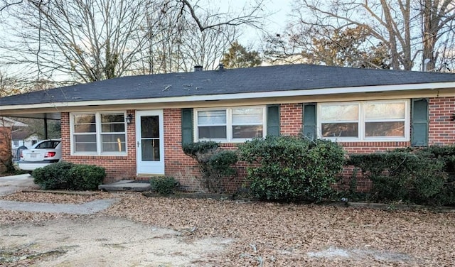 ranch-style home with a carport